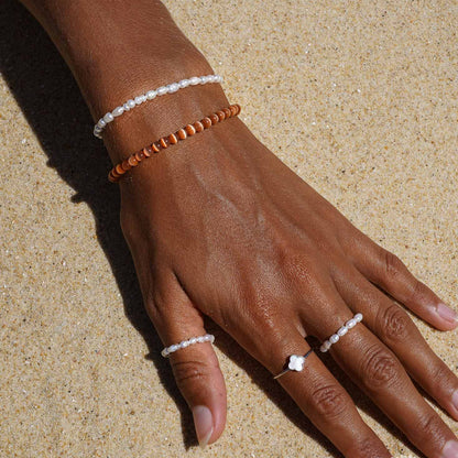 Le bracelet cocco sélénité orange Belyness Bijoux acier inoxydable tendance femme artisanaux fait main perle d’eau douce collier mode éco-responsable perles de culture douce boucle d'oreilles perle de nacre bracelet en pierres fines bague en pierres naturelles création upcycling recyclés écologique éthique matériaux durable bague minimaliste bohème chic authentique océan mer aventure bijoux surf été skate bellyness belynes bely ness nes belly bellynes beliness bellines belines